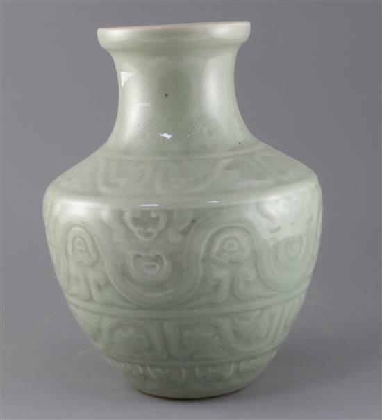 A Chinese celadon glazed archaistic moulded vase, Qianlong underglaze blue seal mark to base, probably 19th century, H.30cm